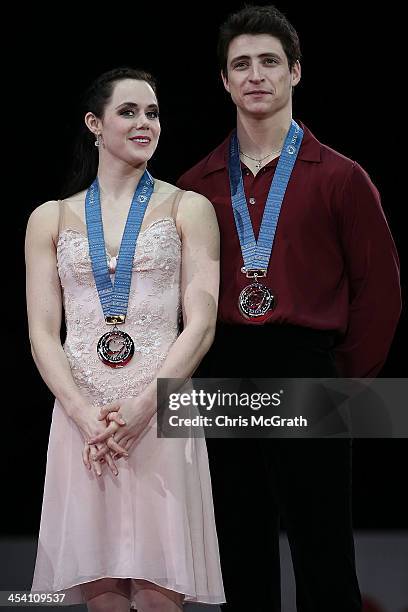 Tessa Virtue and Scott Moir of Canada pose with their medals during the victory ceremony for the Ice Dance Free Dance Final on day three of the ISU...