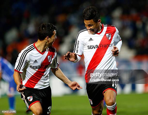 Teofilo Gutierrez celebrates with teammate Tomas Martinez after scoring the fourth goal of his team during a match between Godoy Cruz and River Plate...