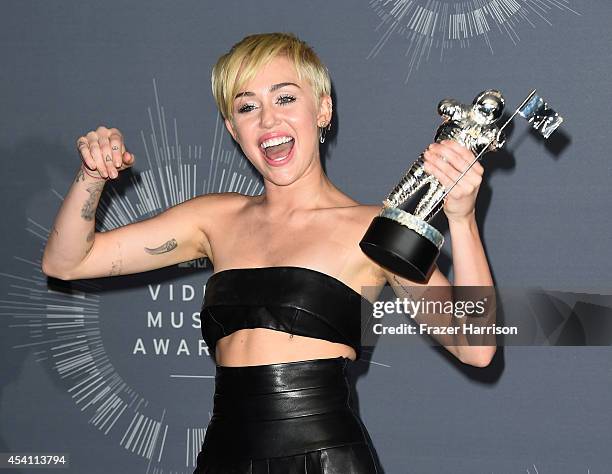 Recording Artist Miley Cyrus, winner of Video of the Year award for 'Wrecking Ball', poses in the press room during the 2014 MTV Video Music Awards...