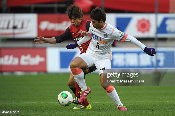 Kazuyuki Morisaki of Sanfrecce Hiroshima and Yuya Osako of Kashima Antlers compete for the ball during the J.League match between Kashima Antlers and...