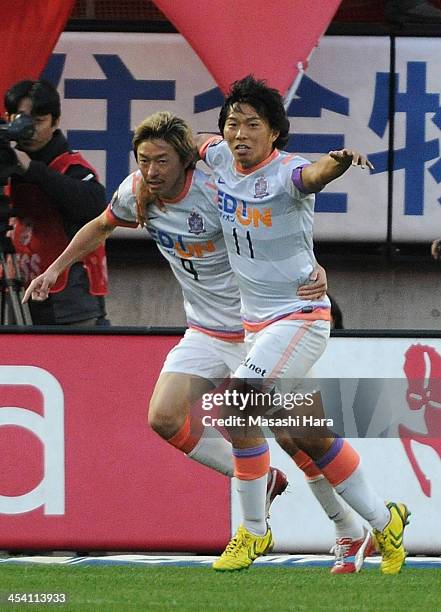 Hisato Sato and Naoki Ishihara of Sanfrecce Hiroshima celebrate the first goal during the J.League match between Kashima Antlers and Sanfrecce...