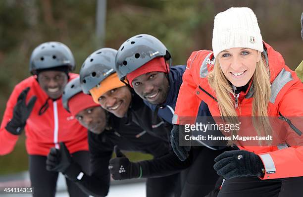 German speedskater Anni Friesinger and the marathon runners Amos, Isaac, Sammy and Leonard attend 'Real Cool Runnings' Photocall on December 7, 2013...