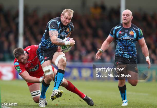 Damian Welch of Exeter Chiefs is tackled by Bakkies Botha of Toulon during the Heineken Cup Pool Two match between Exeter Chiefs and Toulon at Sandy...