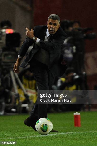 Toninho Cerezo,coach of Kashima Antlers throws a ball during the J.League match between Kashima Antlers and Sanfrecce Hiroshima at Kashima Stadium on...