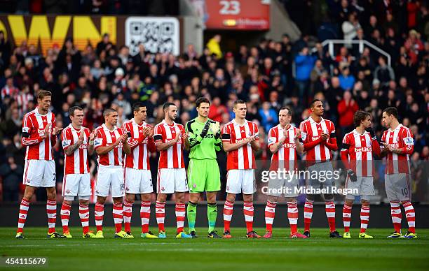 Stoke players take part in the minutes applause in remembrance of Nelson Mandela during the Barclays Premier League match between Stoke City and...