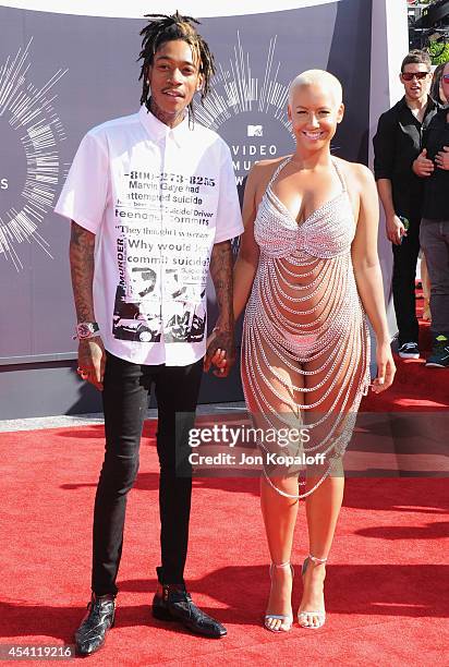 Singer Wiz Khalifa and Amber Rose arrive at the 2014 MTV Video Music Awards at The Forum on August 24, 2014 in Inglewood, California.