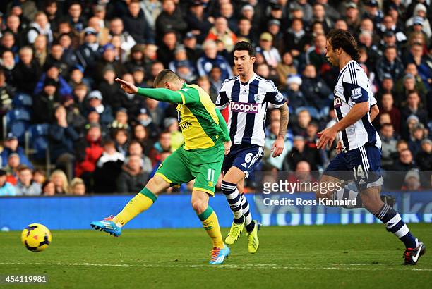 Gary Hooper of Norwich shoots and scores during the Barclays Premier League match between West Bromwich Albion and Norwich City at The Hawthorns on...