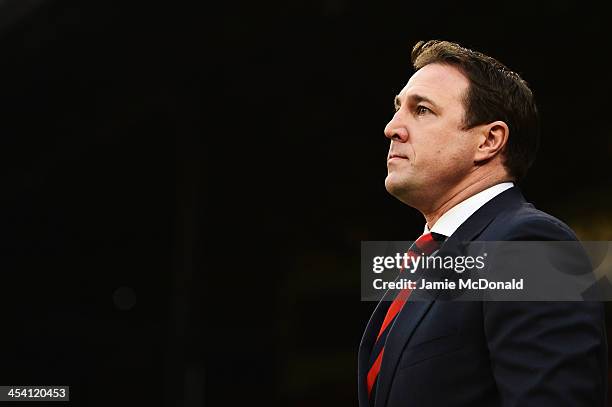 Cardiff City manager Malky Mackay walks to his team dugout before the start of the Barclays Premier League match between Crystal Palace and Cardiff...