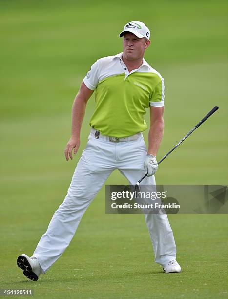 Jamie Donaldson of Wales reacts to a shot during the third round of the Nedbank Golf Challenge at Gary Player CC on December 7, 2013 in Sun City,...