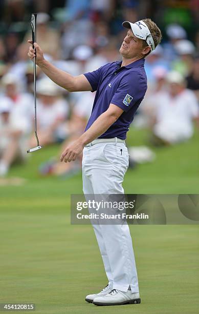 Luke Donald of England reacts to a putt during the third round of the Nedbank Golf Challenge at Gary Player CC on December 7, 2013 in Sun City, South...