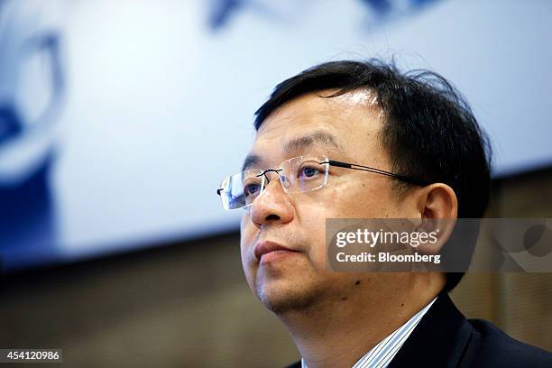 Wang Chuanfu, chairman of BYD Co., attends a news conference in Hong Kong, on Monday, Aug. 25, 2014. BYD, a Chinese electric-car maker partially...