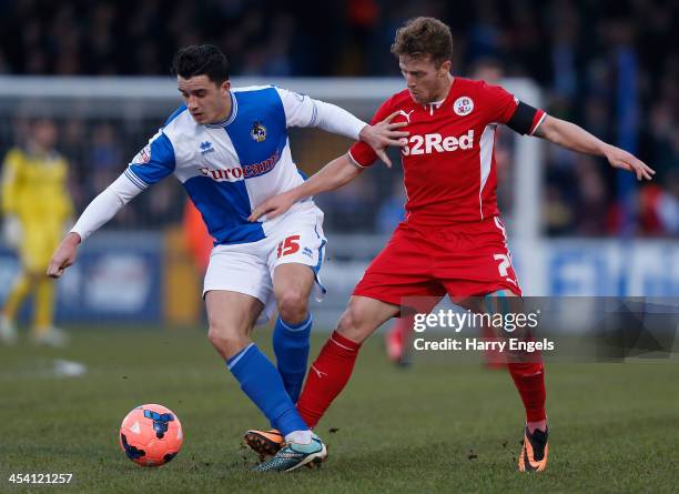 Oliver Norburn of Bristol Rovers is hassled by Billy Clarke of Crawley Town during the FA Cup Second Round match between Bristol Rovers and Crawley...