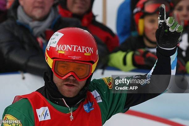 Austria's Markus Schairer reacts at the end of the men's snowboard cross event as part of the FIS Snowboard world cup season opening, in Schruns...