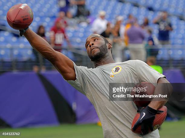 Washington wide receiver Pierre Garcon practices catching balls in the end zone during warm ups before the Washington Redskins play the Baltimore...