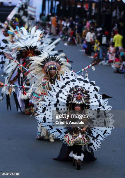 Indonesian models showcase a design on the catwalk during the 13th Jember Fashion Carnival 2014 in Jember, Indonesia on August 24, 2014. This years...