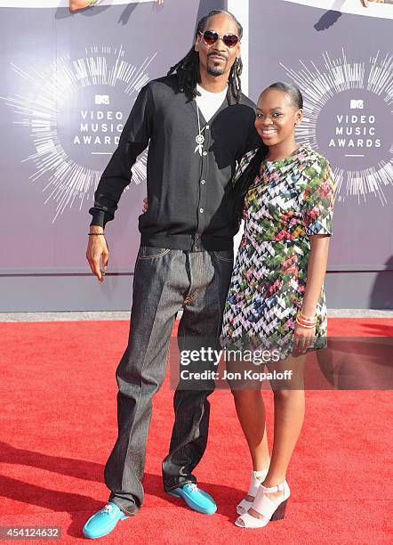 Rapper Snoop Dogg and Cori Broadus arrive at the 2014 MTV Video Music Awards at The Forum on August 24, 2014 in Inglewood, California.