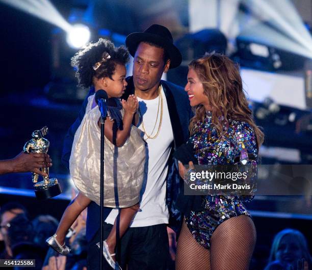 Rapper Jay Z and singer Beyonce with daughter Blue Ivy Carter onstage during the 2014 MTV Video Music Awards at The Forum on August 24, 2014 in...