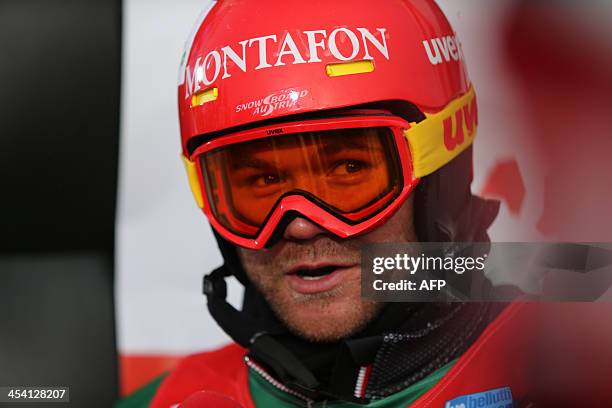 Austria's Markus Schairer addresses the media during the men's snowboard cross event as part of the FIS Snowboard world cup season opening, in...