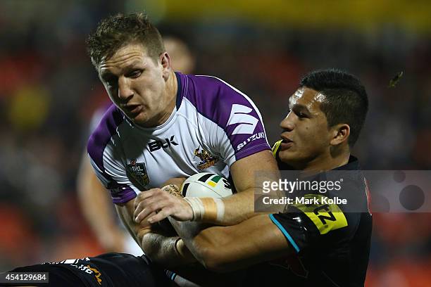 Ryan Hoffman of the Storm is tackled during the round 24 NRL match between the Penrith Panthers and the Melbourne Storm at Sportingbet Stadium on...