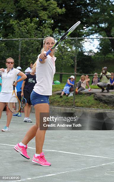 Tennis player Dominika Cibulkova attends the City Parks Foundation's tennis clinic at the Central Park Tennis Center on August 24, 2014 in New York...