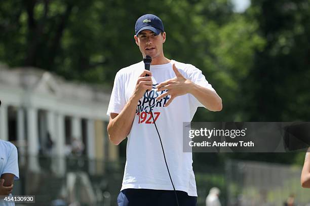 Tennis player John Isner attends the City Parks Foundation's tennis clinic at the Central Park Tennis Center on August 24, 2014 in New York City.