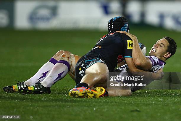 Jamie Soward of the Panthers tackles Billy Slater of the Storm during the round 24 NRL match between the Penrith Panthers and the Melbourne Storm at...