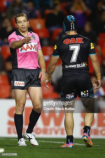 Ben Cummins speaks to Jamie Soward of the Panthers during the round 24 NRL match between the Penrith Panthers and the Melbourne Storm at Sportingbet...