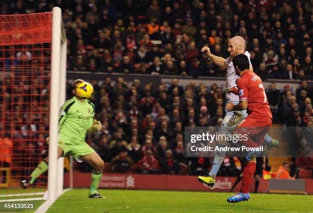 Luis Suarez of Liverpool scores his first goal during the Barclays Premier League match between Liverpool and West Ham United at Anfield on December...