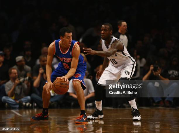 Pablo Prigioni of the New York Knicks in action against Tyshawn Taylor of the Brooklyn Nets during their game at the Barclays Center on December 5,...