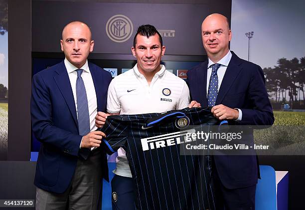 Gary Medel is presented as new signing for FC Internazionale Milano by Sporting Director of FC Internazionale Milano Piero Ausilio and Managing...