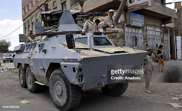 Yemeni security forces stand guard for possible clashes following falling down of the negotiation between Yemeni government and Houthis in Sanaa...