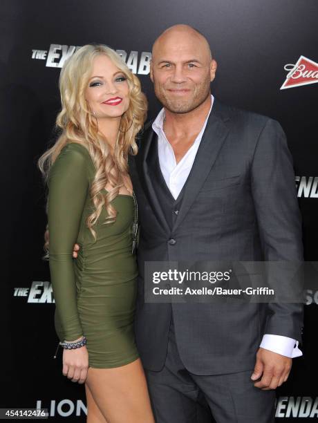 Actors Mindy Robinson and Randy Couture arrive at the Los Angeles premiere of 'The Expendables 3' at TCL Chinese Theatre on August 11, 2014 in...