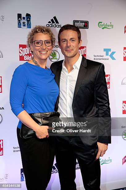 Alexander Bommes with his wife Julia Westlake poses for the media before the Sport Bild Awards at Fischauktionshalle on August 25, 2014 in Hamburg,...