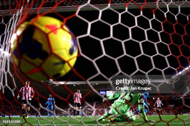 Paulinho of Tottenham shoots past Vito Mannone, Goalkeeper of Sunderland for his goal during the Barclays Premier League match between Sunderland and...