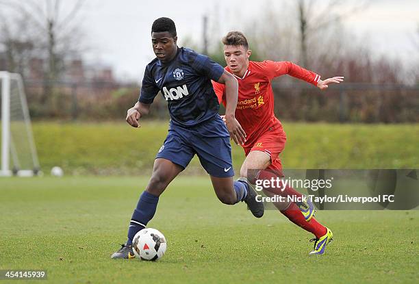 Tyler Reid of Manchester United and Joe Maguire of Liverpool in action during the Barclays Premier League Under 18 fixture between Liverpool and...