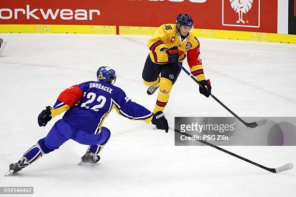 Philip Holm of Djurgarden competes with Jiri Ondracek of PSG Zlin during the Champions Hockey League group stage game between PSG Zlin and Djurgarden...