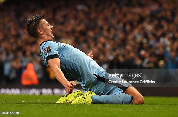 Stevan Jovetic of Manchester City celebrates scoring the opening goal during the Barclays Premier League match between Manchester City and Liverpool...