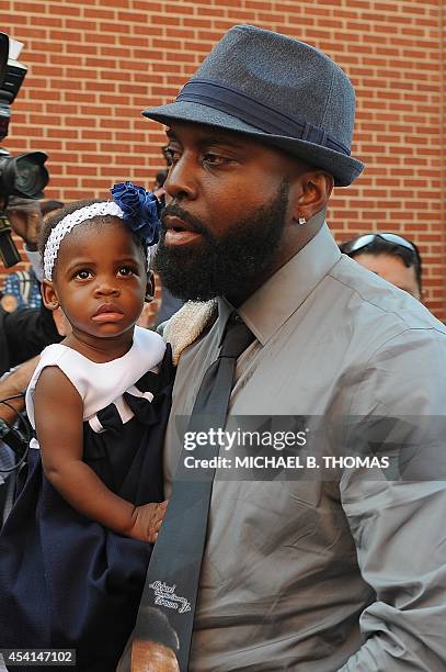 Michael Brown Sr. Enters the Friendly Temple Missionary Baptist Church for the funeral of his slain 18-year old son Michael Brown Jr. In St. Louis,...