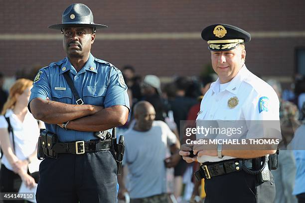 Captain Ronald Johnson , of the MIssouri HIghway Patrol is seen with St. Louis Poilce Chief Sam Dodson prior to the funeral of slain 18-year old...