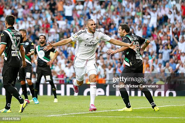 Karim Benzema of Real Madrid celebrates after scoring the opening goal during the La Liga match between Real Madrid CF and Cordoba CF at Estadio...