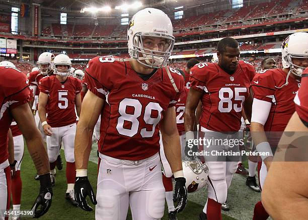 Tight end John Carlson of the Arizona Cardinals walks off the field before the preseason NFL game against the Cincinnati Bengals at the University of...