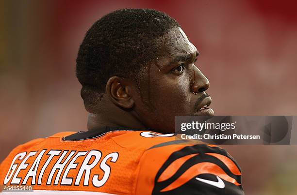 Defensive end Robert Geathers of the Cincinnati Bengals watches from the sidelines during the preseason NFL game against the Arizona Cardinals at the...