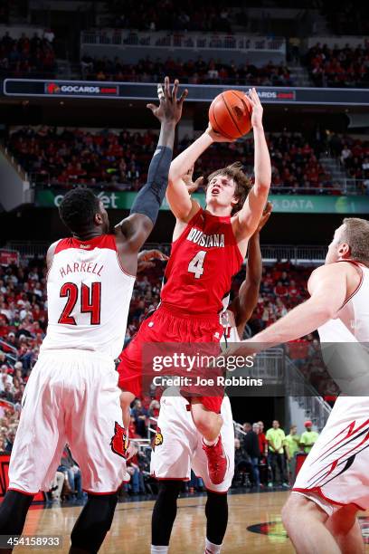 Steven Wronkoski of the Louisiana-Lafayette Ragin' Cajuns shoots the ball against Montrezl Harrell of the Louisville Cardinals during the first half...