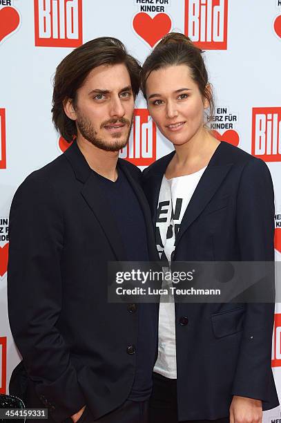 Luca Marinelli and Alissa Jung attend the Ein Herz Fuer Kinder Gala 2013 at Flughafen Tempelhof on December 7, 2013 in Berlin, Germany.