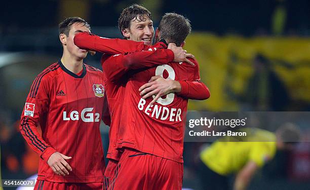 Stefan Kiessling of Leverkusen celebrates with Lars Bender after winning the Bundesliga match between Borussia Dortmund and Bayer Leverkusen at...