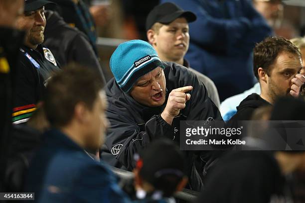Panthers supporter shouts at the referees as they leave the field during the round 24 NRL match between the Penrith Panthers and the Melbourne Storm...