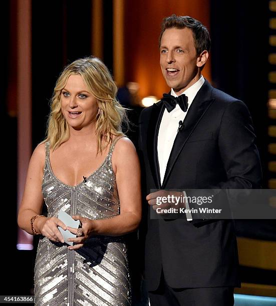 Actress Amy Poehler and host Seth Meyers speak onstage at the 66th Annual Primetime Emmy Awards held at Nokia Theatre L.A. Live on August 25, 2014 in...