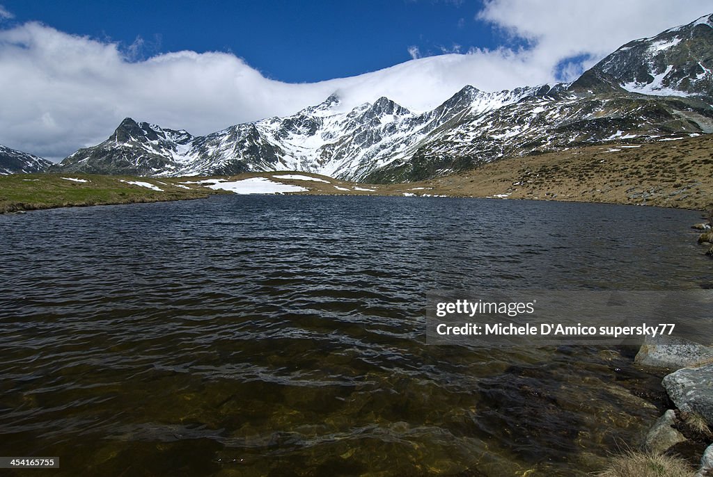 Alpine lake with snowy peaks