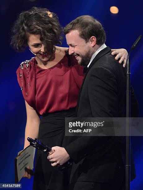 Belgian director Tom Van Avermaet receives his award at the 26th European Film Awards ceremony on December 7, 2013 in Berlin. Every year, the various...