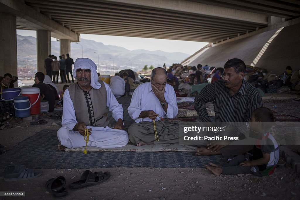 Yazidi refugees from Sinjar live beneath a motorway...